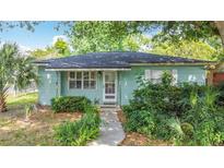 Charming single-story home featuring lush landscaping and a welcoming front entrance at 401 Maryland Ave, St Cloud, FL 34769