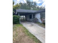 Exterior view of home with a covered carport and driveway at 2071 Liston Ct, Orlando, FL 32811