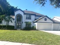 Charming two-story home featuring a two-car garage and well-maintained landscaping at 3170 Zaharias Dr, Orlando, FL 32837