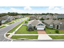 Well maintained single story home in a desirable neighborhood with a neatly manicured lawn at 3443 Florigold Grove St, Clermont, FL 34711