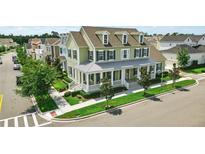Charming home with a welcoming front porch nestled in a scenic neighborhood at 1850 Treasure Cv, Celebration, FL 34747