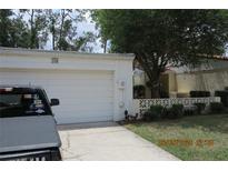 Charming one-story home featuring a garage and beautifully maintained landscaping at 386 San Jose Dr, Winter Haven, FL 33884