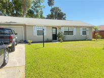 Charming single-story home featuring a well-maintained lawn, classic shutters, and inviting curb appeal at 622 Dromedary Ct, Kissimmee, FL 34759