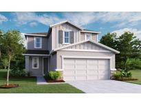 Charming two-story home with a two-car garage, landscaped front yard, and neutral color palette at 5224 Bee Balm St, Lake Hamilton, FL 33851