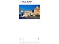 Charming two-story townhouse with colorful facade and well-maintained landscaping at 2203 San Vittorino Cir # 103, Kissimmee, FL 34741