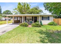 Charming single-story home with a well-maintained lawn and covered front porch, offers inviting curb appeal at 512 Maryland Ave, St Cloud, FL 34769