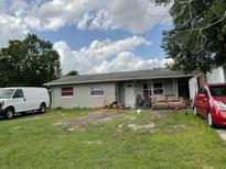 Modest single-story home featuring a simple front yard, awaiting a touch of landscaping at 2329 W Doris St, Kissimmee, FL 34741