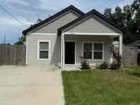 Charming single-story home featuring a welcoming front porch and well-maintained lawn at 2453 Sipes Ave, Sanford, FL 32771