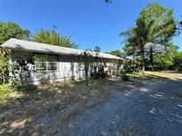 Charming single-story home with a simple architectural design and mature landscaping at 429 Diamond Acres Rd, Davenport, FL 33837