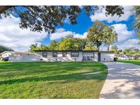 Charming single-story home with a well-maintained lawn and inviting curb appeal at 502 Engel Dr, Orlando, FL 32807