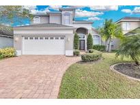 Charming two-story home with a well-manicured lawn and welcoming curb appeal at 721 Hardwood Cir, Orlando, FL 32828