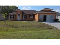 Charming one-story home with a well-maintained lawn and inviting curb appeal at 1107 Dartford Dr, Kissimmee, FL 34758
