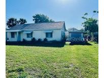 A charming single-story house with a spacious front yard, perfect for outdoor activities and curb appeal at 1309 N Thacker Ave, Kissimmee, FL 34741