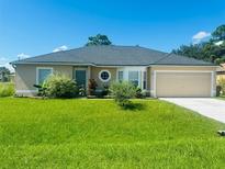 Charming one-story home featuring a well-maintained lawn and inviting curb appeal at 236 Rontunda Dr, Kissimmee, FL 34758