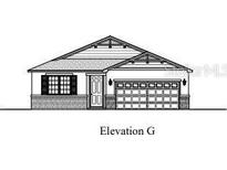 Charming single-story home with a two-car garage and decorative detailing along the roofline at 159 Waterstone Loop, Tavares, FL 32778