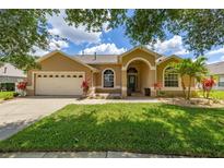 Charming single-story home featuring a well-manicured lawn and inviting curb appeal at 3125 Samosa Hill Cir, Clermont, FL 34714