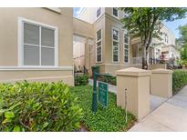 Beautiful townhome exterior with manicured landscaping and visible unit number signage at 438 Water St # 438, Celebration, FL 34747