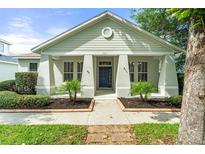 Charming single-story home with a welcoming front porch and neatly landscaped yard at 7013 Beargrass Rd, Harmony, FL 34773