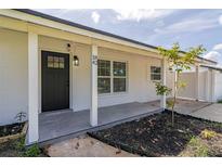 Charming home featuring a covered porch, updated fixtures, and freshly painted exterior at 1842 Puritan Ave, Winter Park, FL 32792