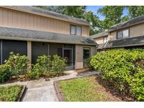 Charming townhouse with a screened lanai and landscaped front entrance at 411 Sheoah Blvd # 33, Winter Springs, FL 32708