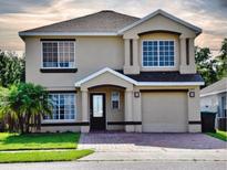 Charming two-story home with a well-maintained front yard and attached garage at 1425 Carey Glen Cir, Orlando, FL 32824