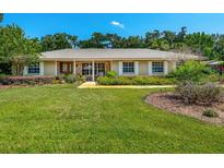 Charming home featuring manicured landscaping and a welcoming facade at 1096 Dyson Dr, Winter Springs, FL 32708