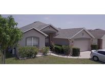 Charming single-story home featuring a well-maintained lawn and inviting curb appeal at 939 Jaybee Ave, Davenport, FL 33897