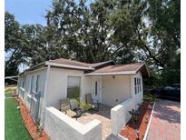 Charming single-story home with a cozy front patio and well-maintained landscaping at 1101 28Th Nw St, Winter Haven, FL 33881