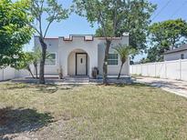 Charming single Gathering home with a well-maintained lawn and arched entryway at 2409 E Magnolia St, Lakeland, FL 33801