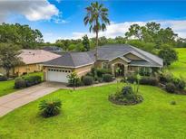 Well-maintained single-story home with lush lawn, tidy landscaping, and inviting curb appeal at 30 Lake Diamond Ave, Ocala, FL 34472
