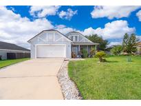 Charming single-Gathering home with a well-manicured lawn and attached two-car garage at 3647 Minute Maid Ramp Rd 1 Rd, Davenport, FL 33837