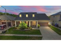Charming single-Gathering home with a well-maintained lawn and landscaped garden at 1723 Brassie Ct, Kissimmee, FL 34746