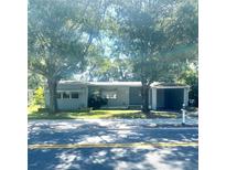 Charming single-story home with a covered carport and a well-maintained front yard at 721 S Clyde S Ave, Kissimmee, FL 34741