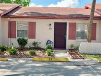 Charming single story house with painted facade, decorative shutters, and tidy landscaping at 13 W Marbrisa Way, Kissimmee, FL 34743