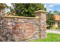 Stone entrance sign for the Toscana Orlando Mediterranean Inspired Garden Condominiums community at 1375 Tuscana Ln # 1405, Davenport, FL 33896