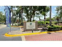 Welcoming entrance to Walden Palms, showcasing lush landscaping and a welcoming community vibe at 4728 Walden Cir # 32, Orlando, FL 32811