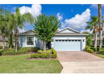 Charming single-Gathering home featuring a two-car garage and well-manicured landscaping at 3606 Solana Cir, Clermont, FL 34711