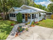 Charming one-story home with inviting walkway, well-manicured lawn and beautiful landscaping at 517 Carolina Ave, St Cloud, FL 34769