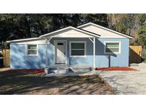 Charming blue exterior with a covered entryway and newly landscaped front yard offers great curb appeal at 217 W Chelsea St, Deland, FL 32720
