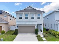 Charming two-story home featuring a two-car garage, well-maintained lawn and meticulous landscaping at 178 Aberdeen St, Davenport, FL 33896