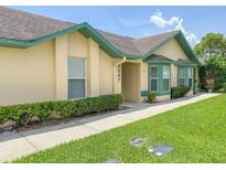 Charming single-story home featuring a well-maintained lawn and inviting facade at 3267 Villa Way Cir, St Cloud, FL 34769