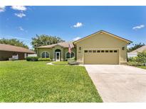 Charming single-Gathering home boasts a well-maintained lawn and a two-car garage, offering a welcoming curb appeal at 1822 Ashton E Dr, St Cloud, FL 34771