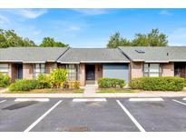 Charming one-story townhouse with well-maintained landscaping and assigned parking spaces at 2907 Prince Oak Ct, St Cloud, FL 34769