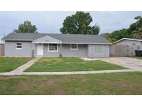 Charming single-story home with a well-maintained front yard and classic curb appeal at 5810 Paradise Ln, Orlando, FL 32808