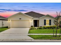 Charming one-story home with a well-manicured lawn and two car garage, perfect for suburban living at 4492 Bluff Oak Loop, Kissimmee, FL 34746