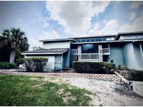 Inviting exterior view of charming home with manicured landscaping and a spacious porch at 806 Pinewood Ct # 3135/6, Haines City, FL 33844