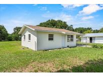 Charming single-story home featuring a well-maintained lawn and a simple, classic design at 120 8Th Wahneta W St, Winter Haven, FL 33880