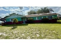 Charming one-story home with solar panels, well-manicured lawn, and brick accents at 2266 Lake Lizzie Ct, St Cloud, FL 34771