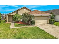 Charming single-Gathering home with well-manicured lawn and attached two car garage at 2054 Hammock Moss Dr, Orlando, FL 32820