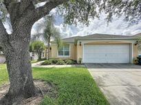 Charming single-story home with a well-manicured lawn and attached two-car garage at 2649 Hemingway Ave, Haines City, FL 33844